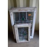 Four large and two small framed leaded lights with stained glass decoration.