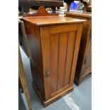 A Victorian walnut pot cupboard.