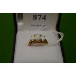 A 9ct gold and opal three stone ring, size M½.