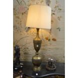 A large decorative brass standard lamp.