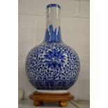 Chinese blue and white bottle vase on stand.