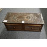 An Anglo Indian carved wood two drawer table top chest.
