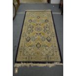 A modern machine made Persian style rug, 200cm x 100cm.