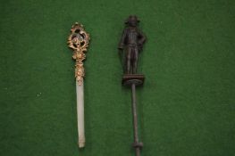 Miniature model of Napoleon and another item.