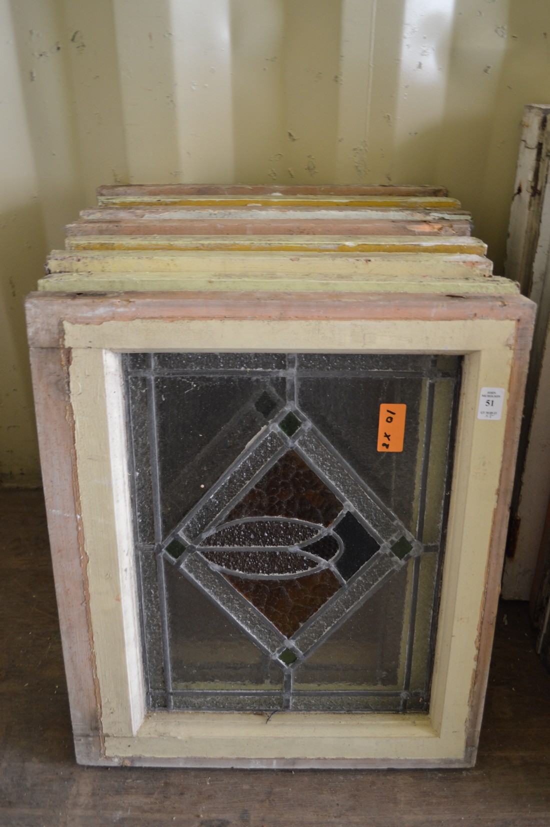 Eight various small framed leaded lights with stained glass decoration.