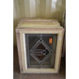 Eight various small framed leaded lights with stained glass decoration.