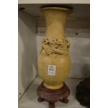 A Chinese carved soapstone vase with stand.