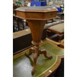 A Victorian walnut octagonal shaped work table.