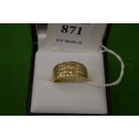 An 18ct gold and diamond four band ring, size N½.