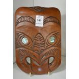 A Maori carved wood mask.