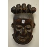 A carved wood tribal mask.