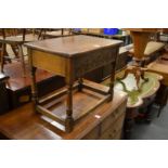 An oak stool with storage compartment.