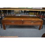 A Chinese hardwood two drawer rectangular low table.