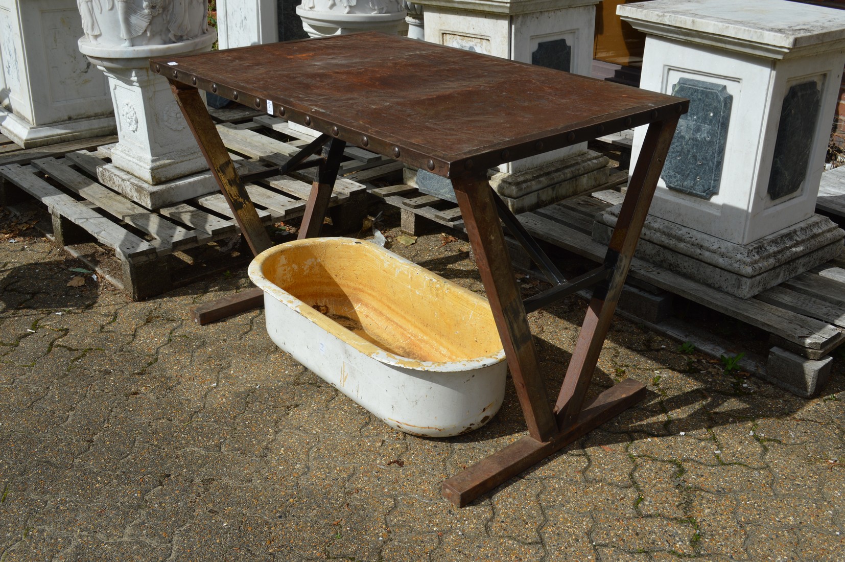 An unusual steel table with angular legs.