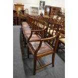 A set of eight Georgian style mahogany dining chairs, two with arms.