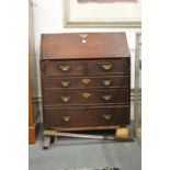 A George III mahogany bureau (faults).