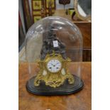 A 19th century French spelter and ormolu figural mantle clock housed under a glass dome.