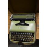 A cased Olivetti Lettera 22 typewriter.