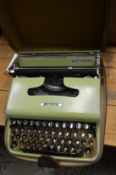 A cased Olivetti Lettera 22 typewriter.