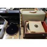 A Decca 10 portable gramophone, gramophone records, an old typewriter and a portable TV.