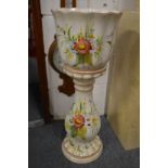 Floral decorated jardiniere on stand.