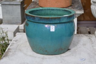 A glazed plant pot.