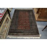 A good modern Bokhara rug, signed, 190cm x 120cm.