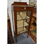 An Edwardian inlaid mahogany display cabinet.