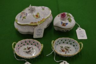 A Herend porcelain box and cover together with a similar smaller box and two small pierced baskets.