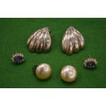 Decorative shell shaped ear clips and other ear studs.