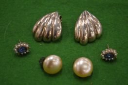 Decorative shell shaped ear clips and other ear studs.