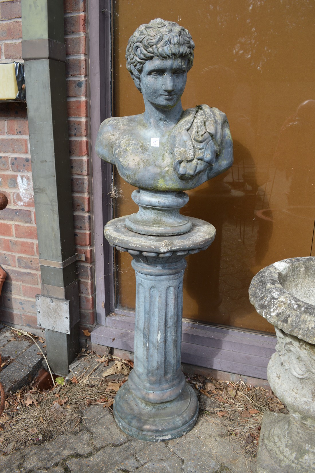 A Roman style bust on column support.