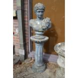 A Roman style bust on column support.