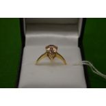 A 9ct gold ring, set with a pear shape stone, size R½.