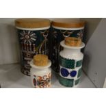 A pair of Portmeirion pottery 'A Magic City' storage jars and two other pieces similar.