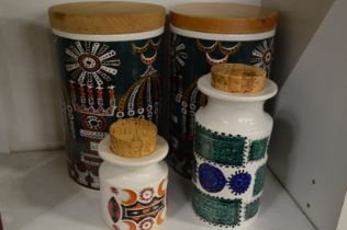 A pair of Portmeirion pottery 'A Magic City' storage jars and two other pieces similar.