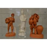 A pair of unusual small terracotta figures and a Chinese blanc de chine figure of Guanyin (head