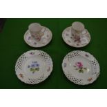 A pair of small Meissen floral decorated plates with pierced borders together with a pair of Dresden