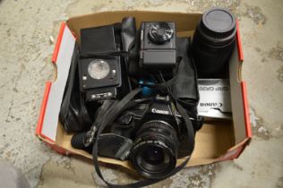 A Canon EOS650 camera with accessories and other items to include binoculars.