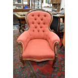 A good Victorian mahogany framed button upholstered armchair.