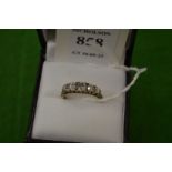 An 18ct gold and diamond five stone ring, size L½.