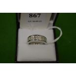 An 18ct white gold and diamond pave set seven stone diamond ring, size M½.