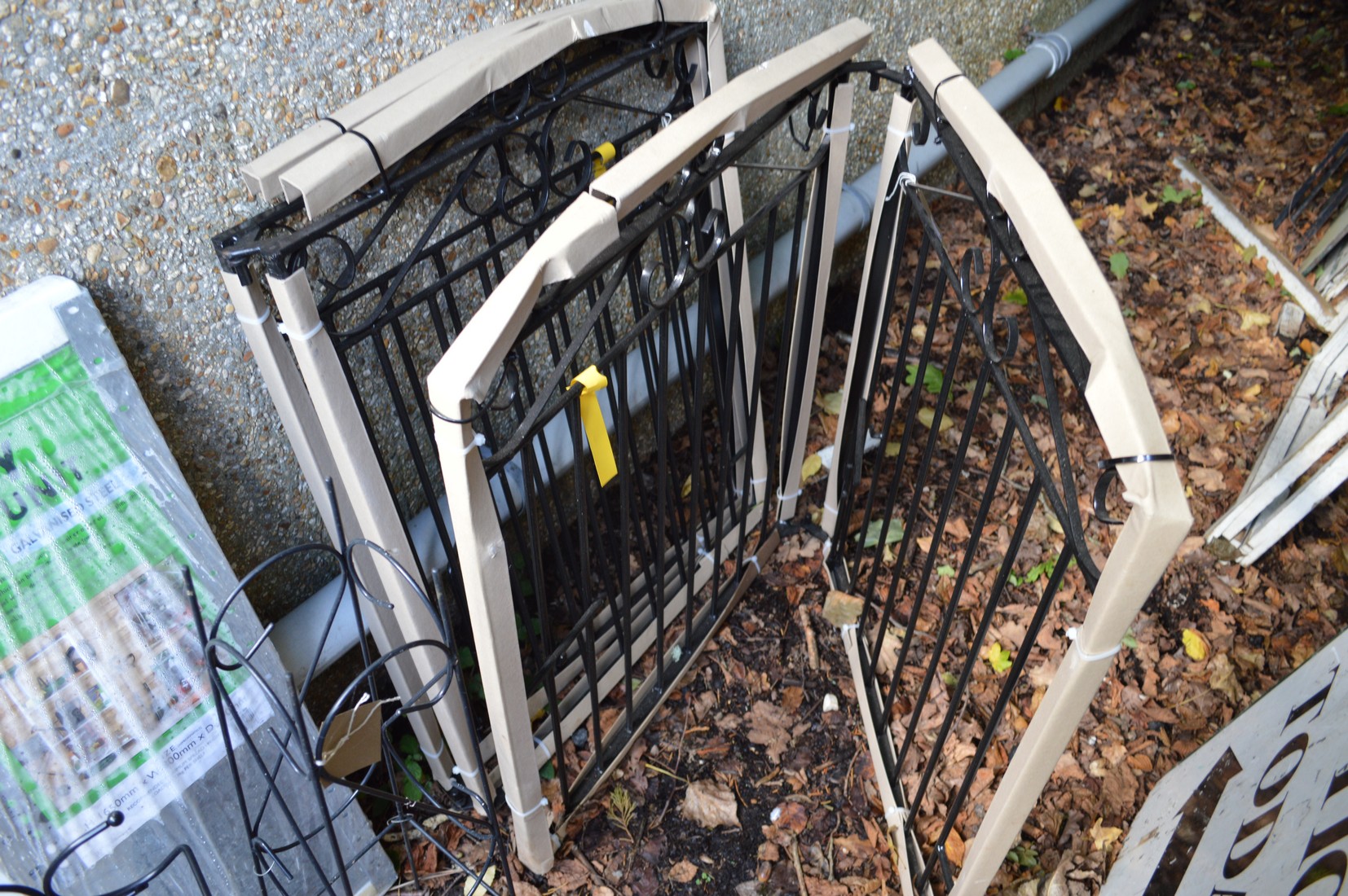 A pair of wrought iron folding driveway gates (appear unused). - Image 2 of 2