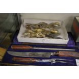 A cased carving set and small quantity of flatware.