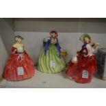 Three Doulton figurines.