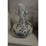 A Chinese peach vase (faults).