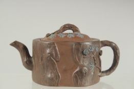 A SMALL CHINESE YIXING TEAPOT, carved with naturalistic forms, the base and inner lid with impressed