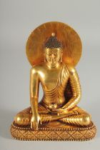 A FINE TIBETAN HEAVY GILT BRONZE BUDDHA, 16cm high.