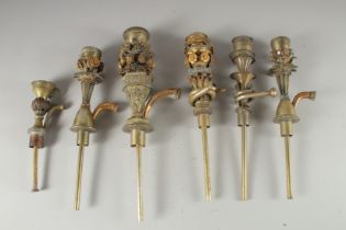 SIX BRASS HUQQA TOPS: INCLUDING THREE WITH FINE TOMBAK GILT OPENWORK FLORAL DECORATION, (6).