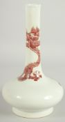 A CHINESE COPPER RED AND WHITE PORCELAIN BOTTLE VASE, the neck with coiled dragon, six-character